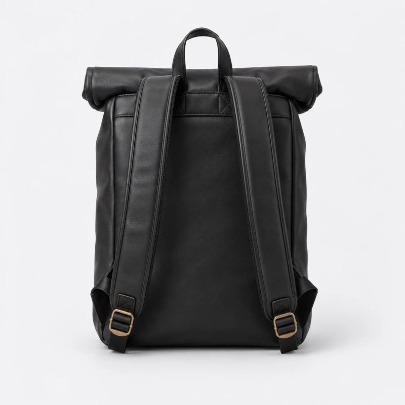 Black leather backpack, back view with the shoulder straps